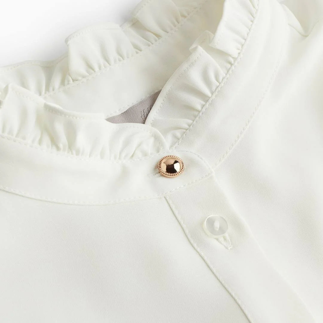 قميص نسائي بياقة كشكش وأكمام طويلة من H&M