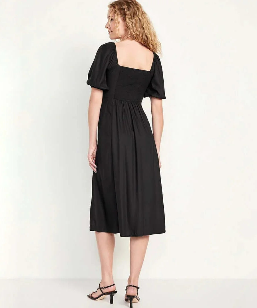 Back view of a model wearing an Old Navy fit and flare crepe midi dress in black, showcasing its relaxed style.