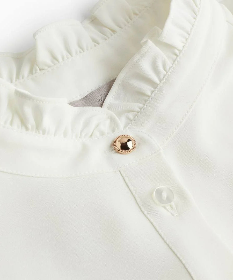 قميص نسائي بياقة كشكش وأكمام طويلة من H&M