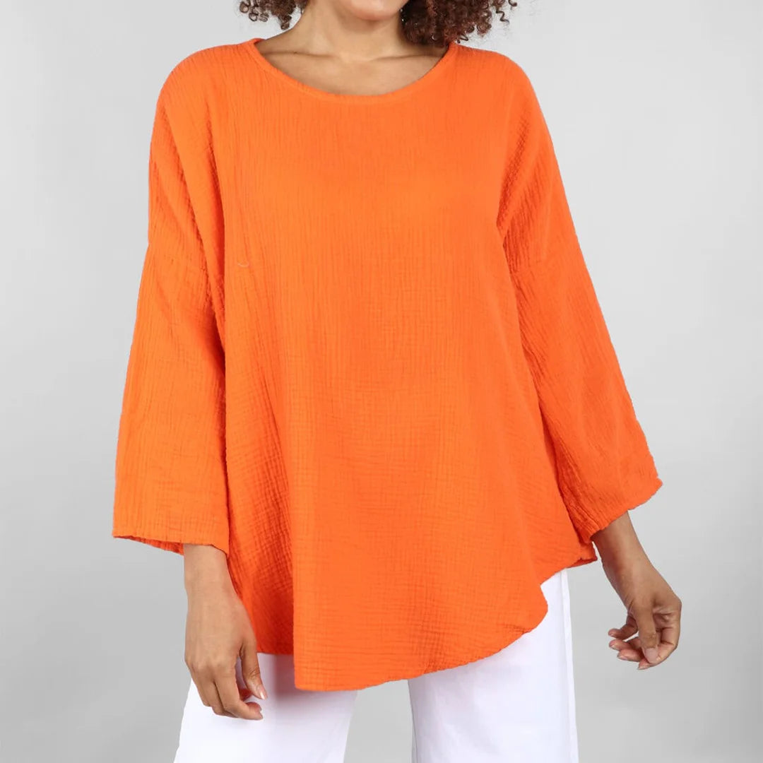 توب نسائي واسع برقبة مستديرة – تصميم مريح وعصري